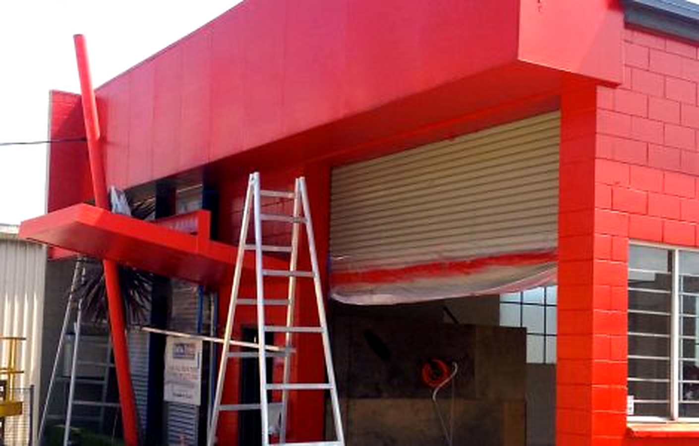Commercial tyre shop exterior painting project in Milton